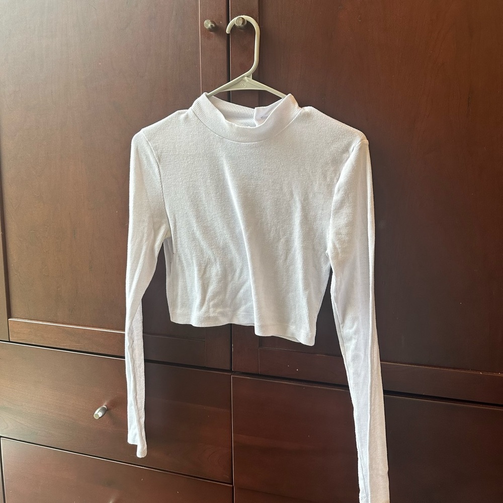 White Cropped Ribbed Longsleeve Top with a mock neckline